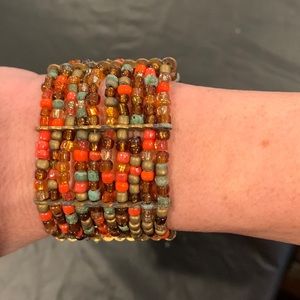 Costume beaded bracelet multicolored coral, bronze, brown see photo